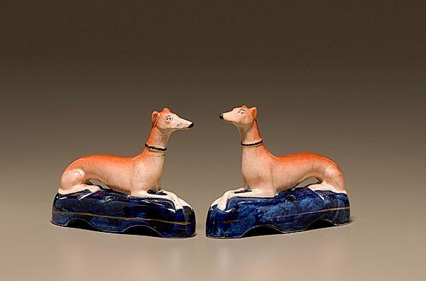 Appraisal: STAFFORDSHIRE WHIPPET INKWELLS English th century A facing pair of