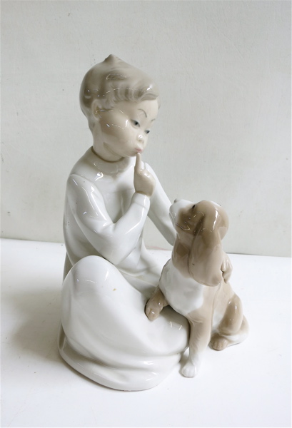 Appraisal: LLADRO BOY WITH DOG FIGURINE of soft paste porcelain Vicente