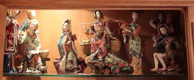 Appraisal: A GROUP OF NINE POTTERY FIGURES of Chinese women in