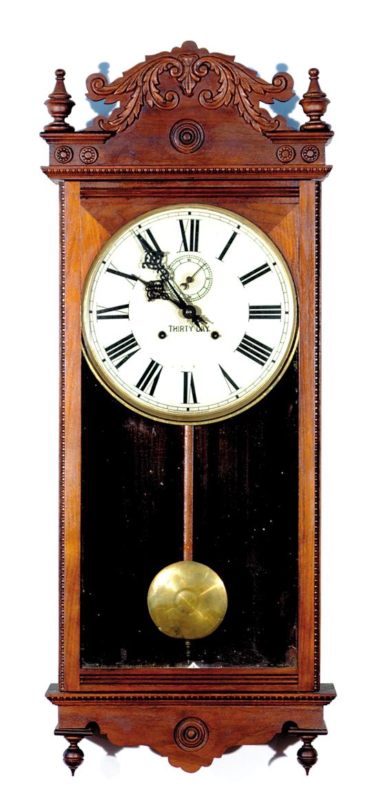 Appraisal: Waterbury Fostoria walnut hanging clock circa Waterbury Clock Co carved