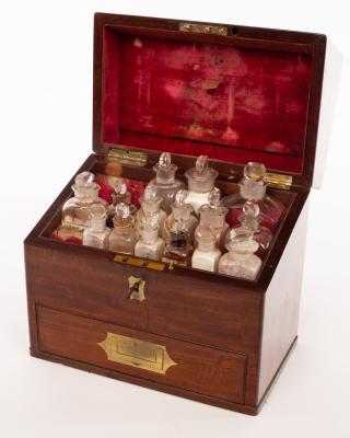 Appraisal: An apothecary's mahogany cabinet th Century with inlaid brass handle