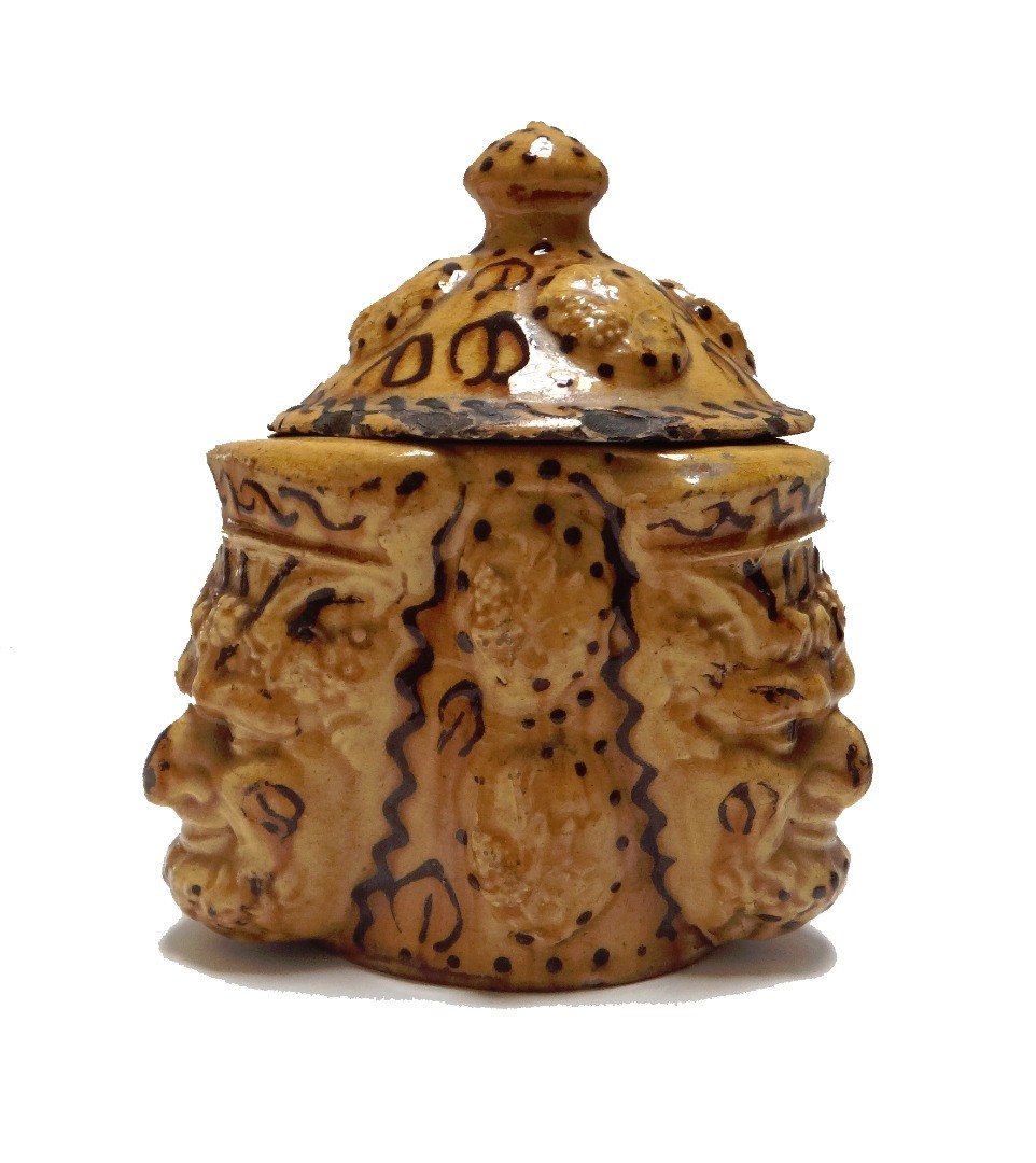 Appraisal: A slipware tobacco box and cover th century relief moulded