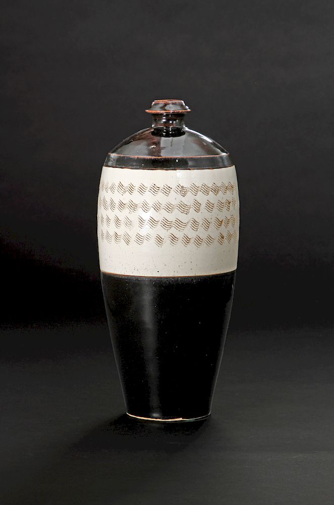 Appraisal: Large Cizhou Black-Glazed Carved Meiping Well potted with a tall