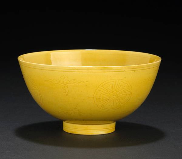 Appraisal: A yellow glazed porcelain bowl Kangxi Mark and Period Incised