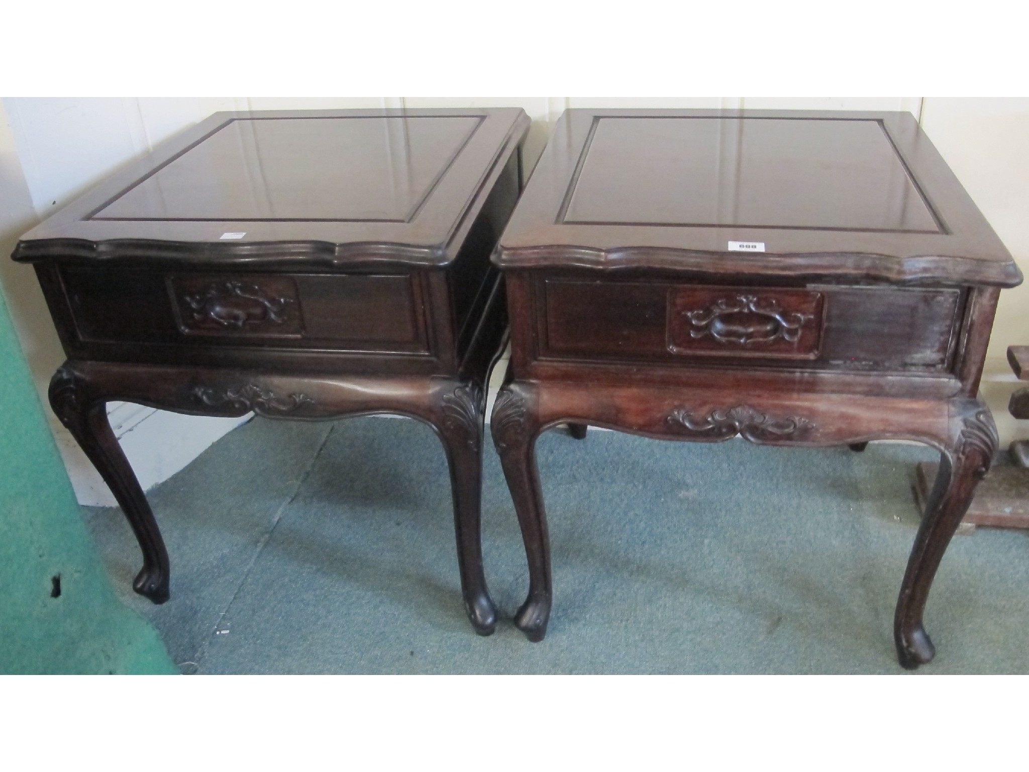 Appraisal: A pair of contemporary Chinese hardwood bedside tables