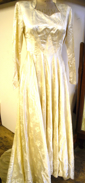 Appraisal: 's embossed ivory silk satin wedding dress with small train