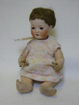 Appraisal: An Ernst Heubach bisque head doll with brown glass sleeping