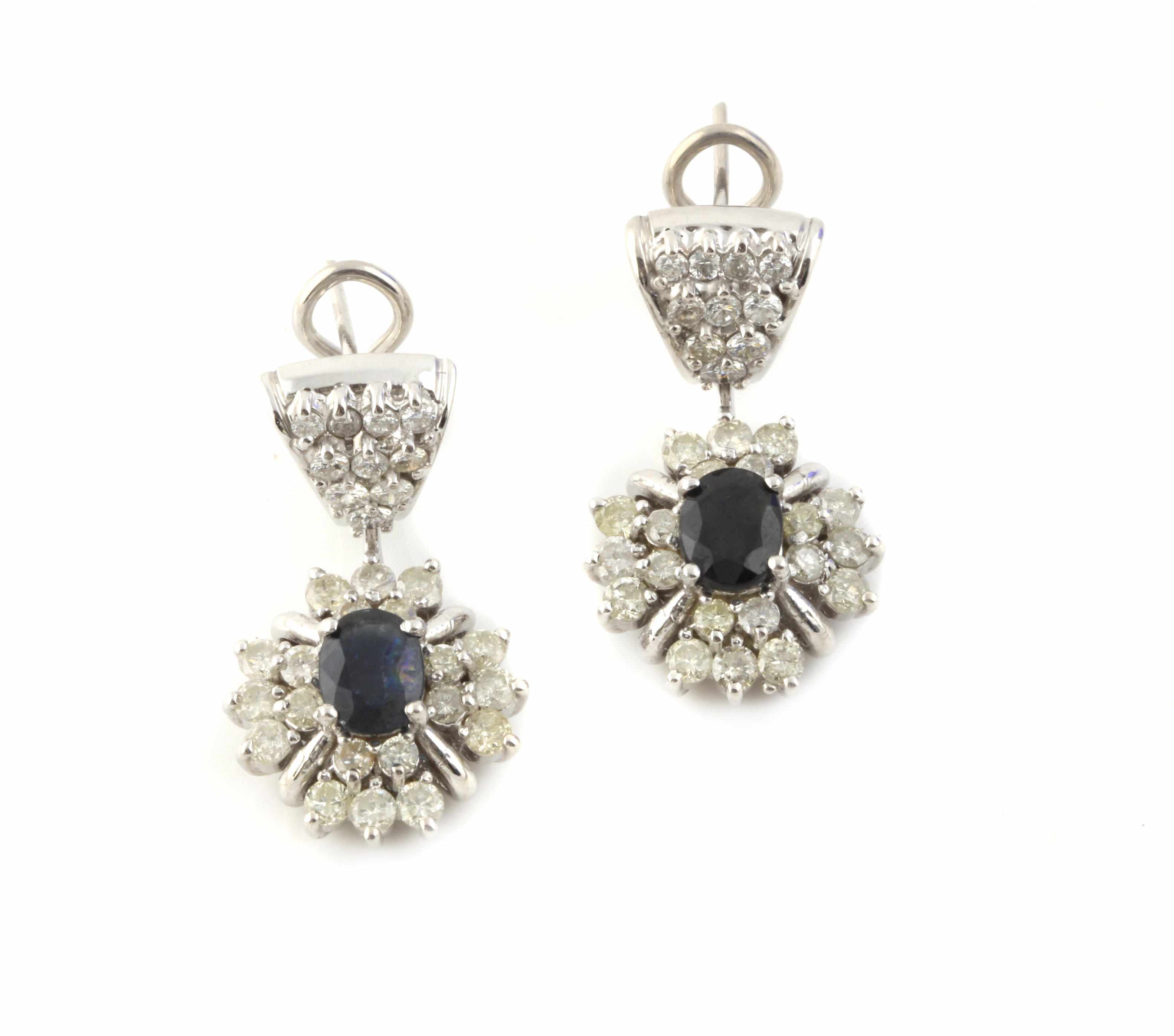 Appraisal: A pair of sapphire diamond and white gold pendant earrings