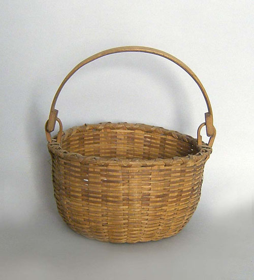 Appraisal: Woven basket with swing handle h dia