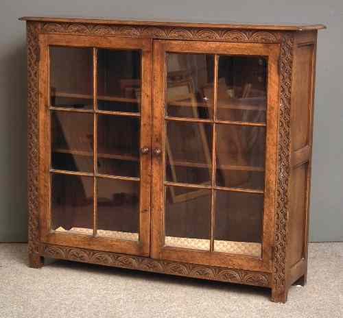 Appraisal: A panelled oak dwarf bookcase of '' th Century'' design