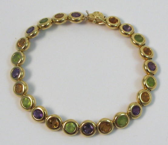 Appraisal: AMETHYST CITRINE AND PERIDOT BRACELET The k yellow gold bracelet