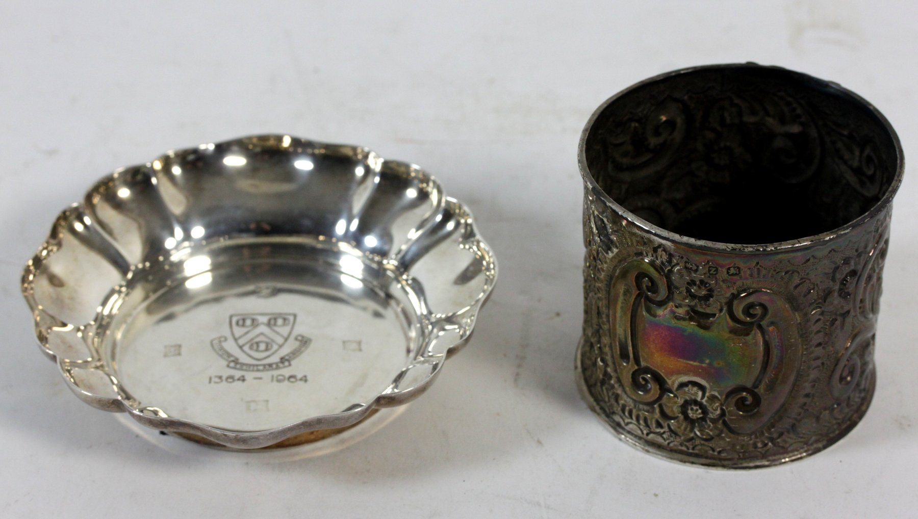 Appraisal: A silver jar Birmingham embossed foliate scrolls and a shaped