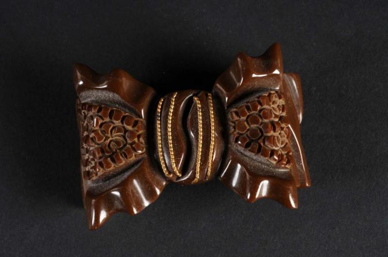 Appraisal: Bakelite Brown Bow Pin Condition Excellent Size L