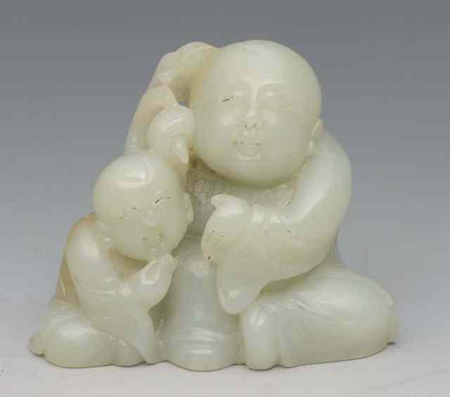 Appraisal: A CHINESE MUTTON FAT JADE of a figural group of