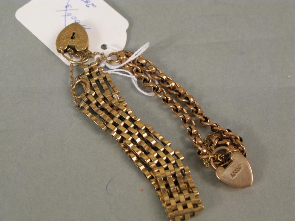 Appraisal: Two ct gold link bracelets each with padlock pendant g