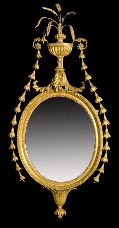 Appraisal: A GEORGE III NEO CLASSICAL GILTWOOD MIRROR the beaded oval