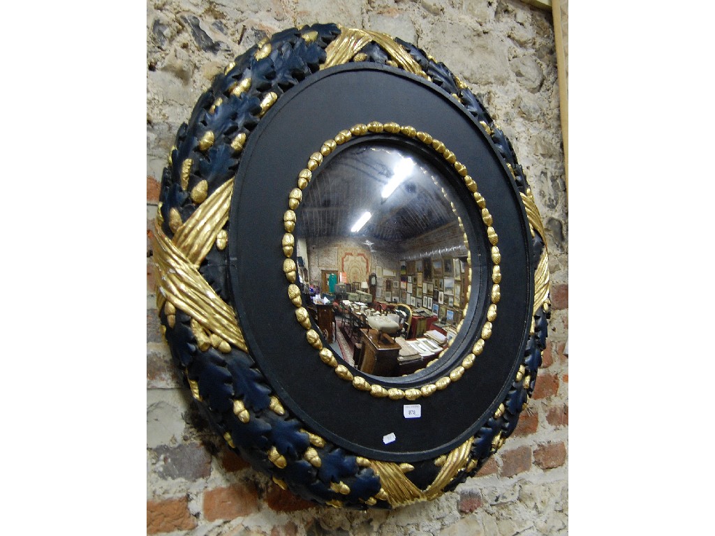 Appraisal: A large Regency circular mirror frame carved with oak leaves