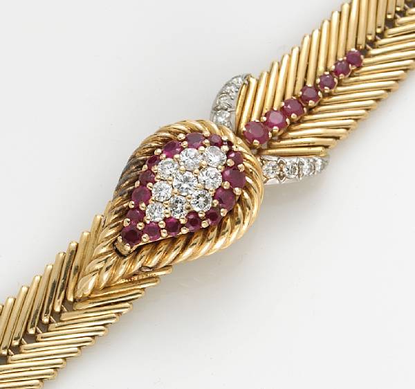 Appraisal: A lady's ruby and diamond covered dial wristwatch dial signed