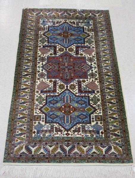 Appraisal: HAND KNOTTED ORIENTAL AREA RUG Indo-Persian triple geometric medallion design