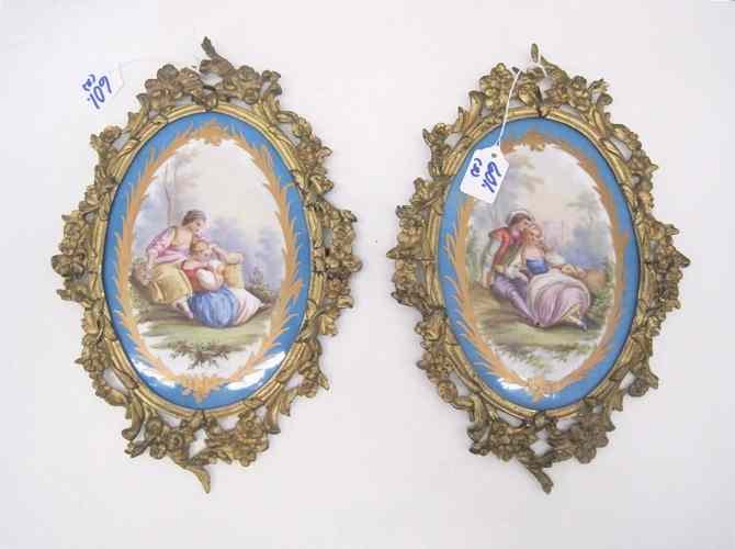 Appraisal: PAIR FRENCH GILT METAL WALL PLAQUES inset with gold enamel