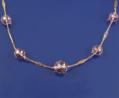 Appraisal: A gold fine link necklace with graduated faceted amethyst beads