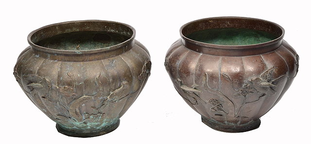 Appraisal: TWO SIMILAR TH CENTURY JAPANESE BRONZE JARDINIERES decorated with prunus