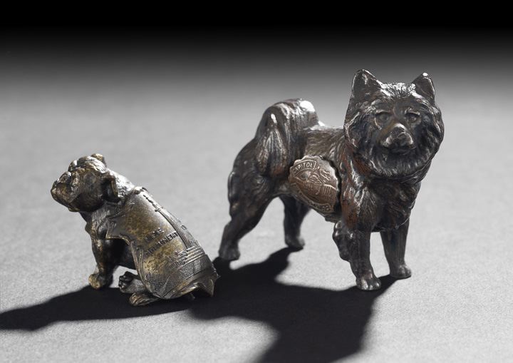 Appraisal: Two Patinated Cast-Metal Figures of Souvenir Dogs second quarter th