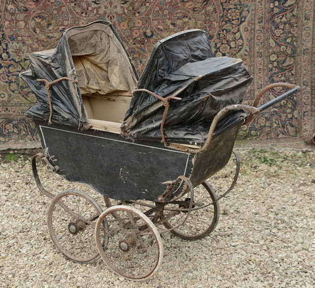 Appraisal: AN EARLY TH CENTURY BLACK PAINTED DOUBLE ENDED SWALLOW PRAM