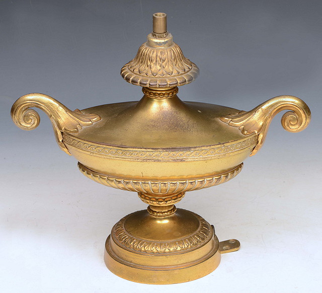 Appraisal: A GILT BRASS TWO HANDLED LAMP of classical urn form