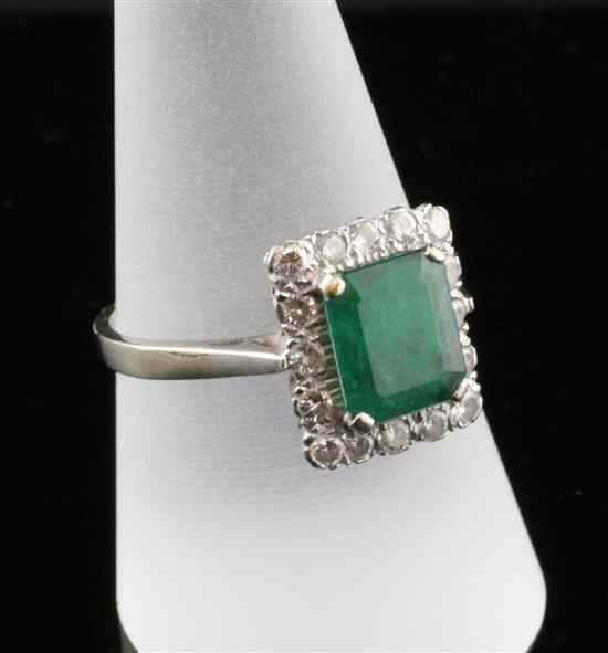 Appraisal: An ct white gold emerald and diamond rectangular cluster ring