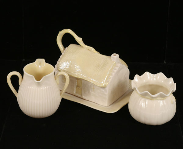 Appraisal: Belleek porcelain table articles cottage figural covered butter sack shape