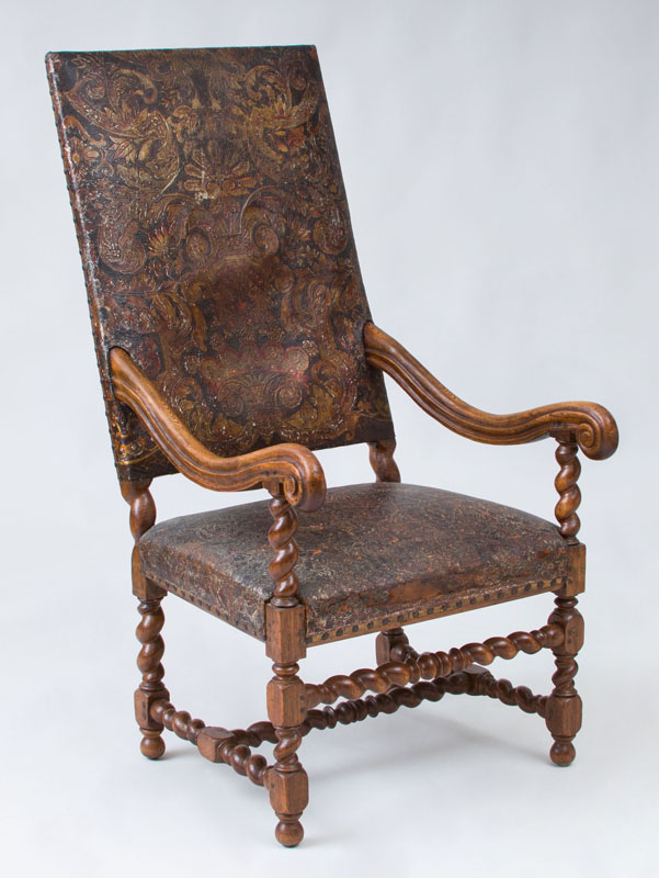 Appraisal: SPANISH BAROQUE STYLE CARVED OAK TALL BACK ARMCHAIR The embossed