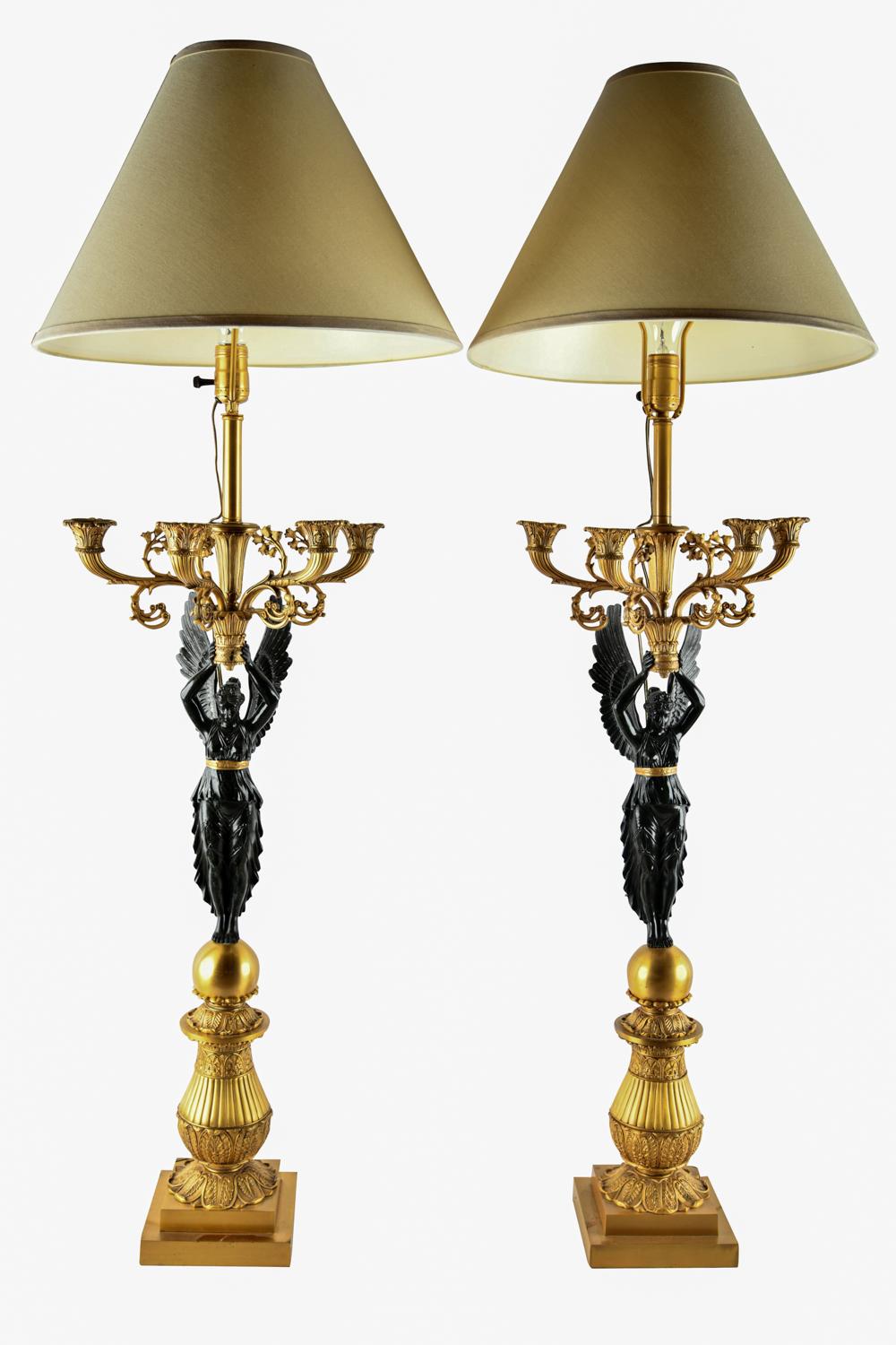 Appraisal: PAIR OF EMPIRE STYLE PATINATED GILT METAL CANDELABRAmounted as table