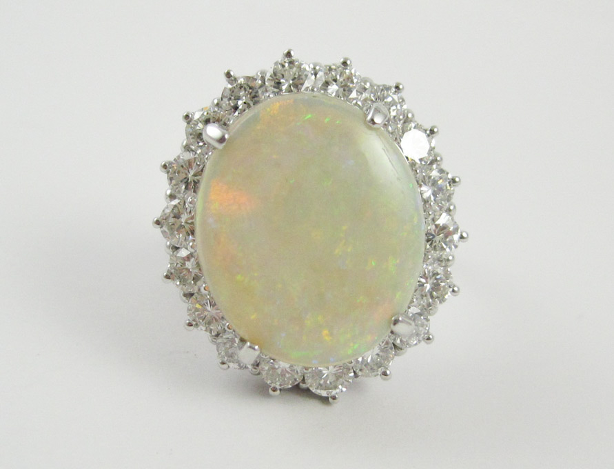 Appraisal: FOURTEEN KARAT WHITE GOLD OPAL AND DIAMOND RING the approximately