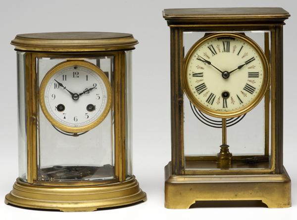 Appraisal: CRYSTAL REGULATOR CLOCKS Two brass clocks include an oval French