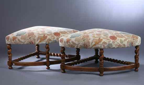 Appraisal: PAIR JACOBEAN STYLE FRUITWOOD OVER-SCALE OTTOMANS Upholstered top barley-twist legs