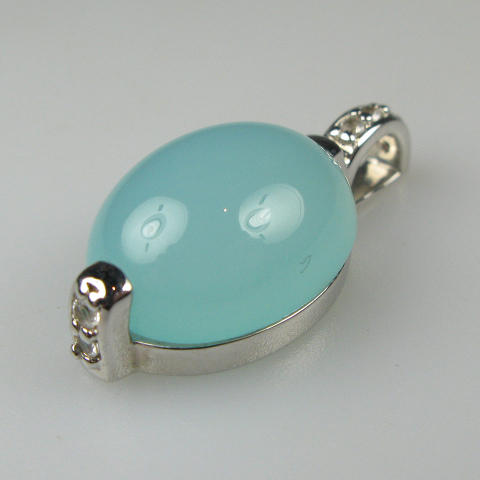 Appraisal: English Silver Pendant set with an oval blue chalcedony cabochon