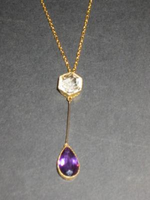 Appraisal: AN AMETHYST PENDANT the pear cut stone collet set in