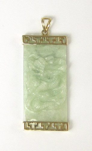 Appraisal: CHINESE CARVED JADE AND FOURTEEN KARAT GOLD PENDANT featuring a