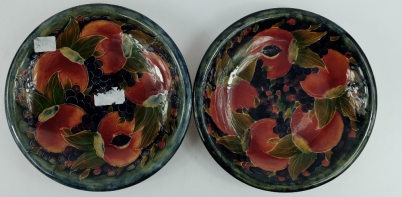 Appraisal: Pair Moorcroft burslem dished plates decorated in the pomegranate berries