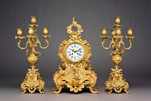 Appraisal: A French brass three piece clock garniture th century in