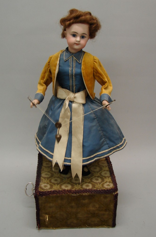 Appraisal: Automaton with bisque head doll DEP This appears to be