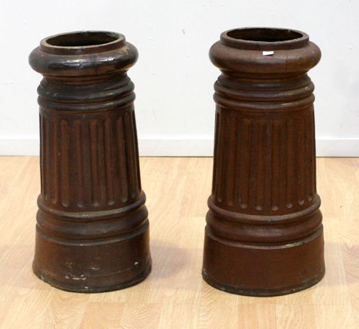 Appraisal: A pair of Australian glazed pottery chimney pots by Bakewell