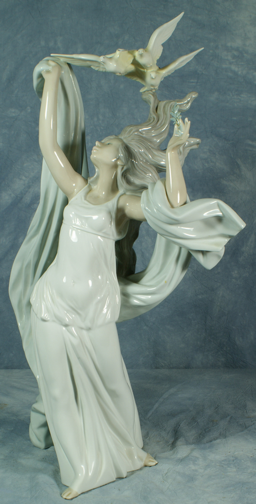 Appraisal: Lladro figurine of a maiden with doves flying overhead one