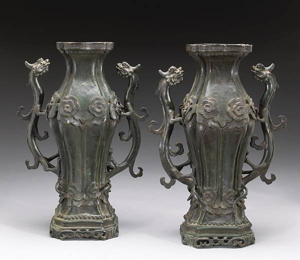 Appraisal: A pair of cast bronze vases Each of square-sectoned baluster