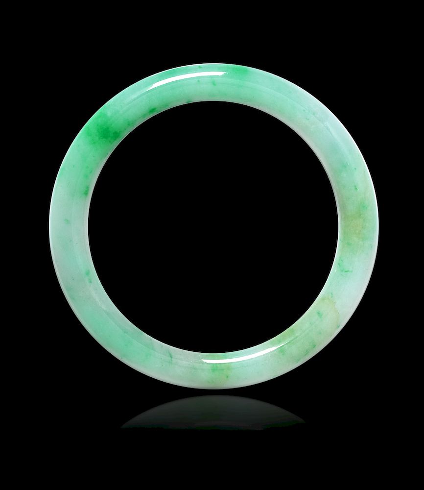 Appraisal: An Apple Green and Celadon Jadeite Bangle Interior in cm