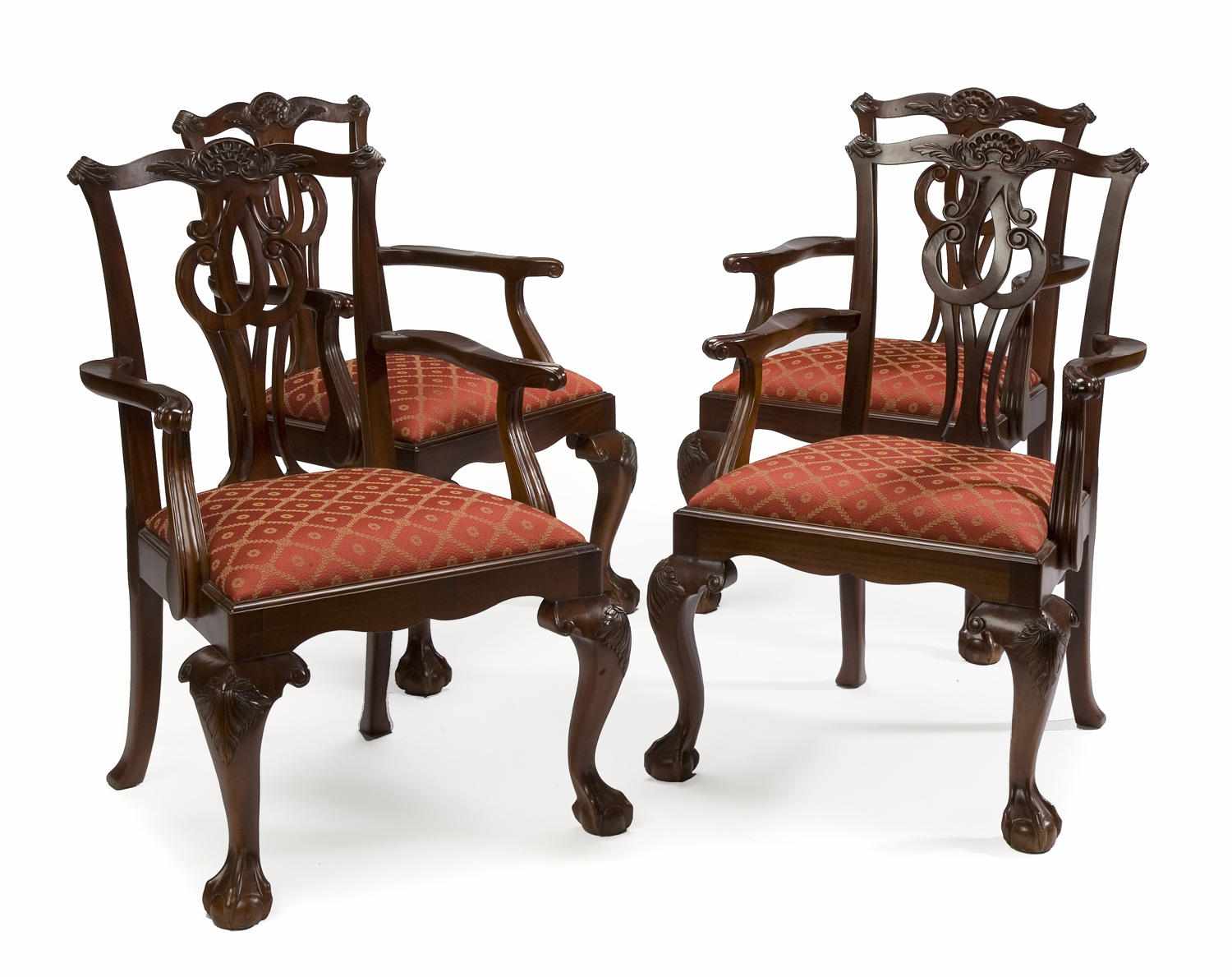 Appraisal: A set of four George lll style carved mahogany armchairs