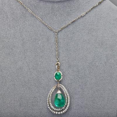 Appraisal: EDWARDIAN EMERALD AND ORIENTAL PEARL LAVALIER Pendeloque-form teardrop-shaped polished emerald