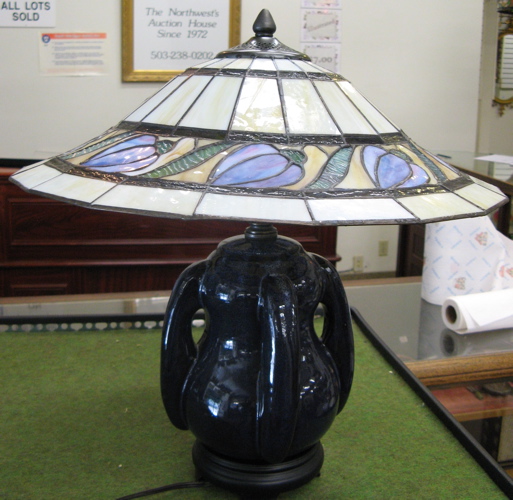 Appraisal: A TIFFANY STYLE STAINED AND LEADED GLASS TABLE LAMP two-light