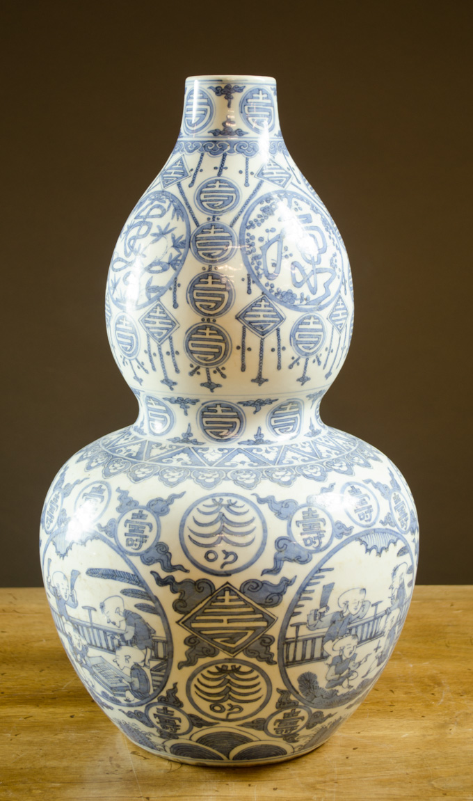 Appraisal: CHINESE BLUE UNDERGLAZE PORCELAIN DOUBLE GOURD VASE the sides decorated